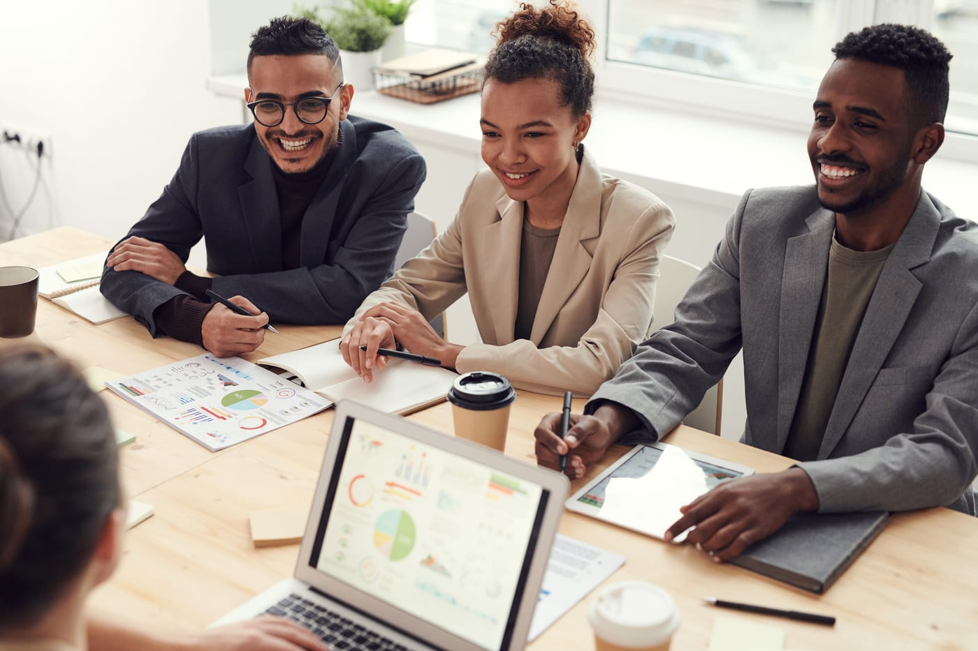 Colleagues collaborating around a table in an office