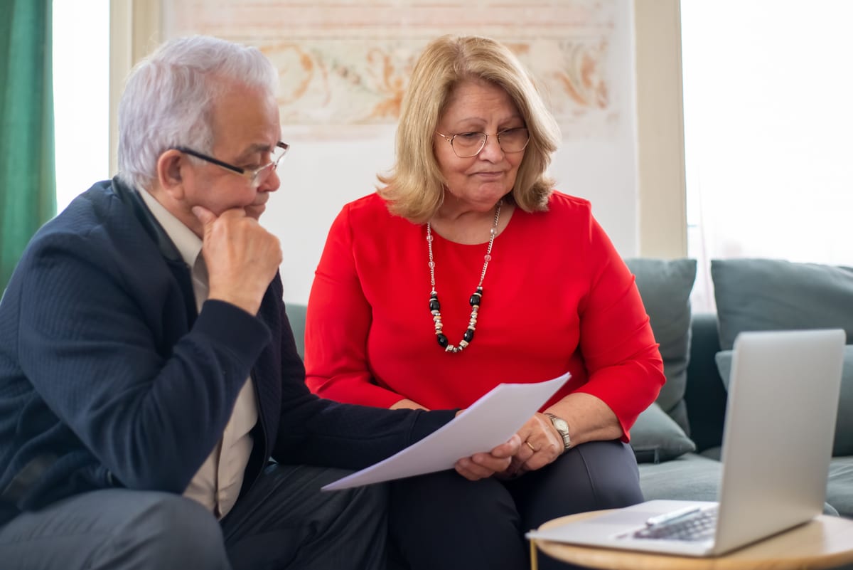 A couple reviewing their retirement savings plan together